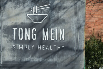 Fototapeta premium Tong Mein ghost sign outside historic building at 207 McCaul St, Toronto