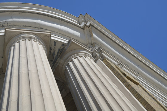 oblique angle view of columns outside entrance to historic CIBC Branch at 90 Danforth Av (at Broadview Av), Toronto