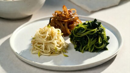 Korean banchan trio bean sprouts seaweed salad and pickles