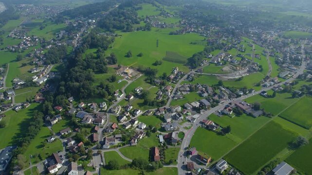 Aerial view around the mountains in Liechtenstein beside the village Triesenberg on a cloudy summer morning