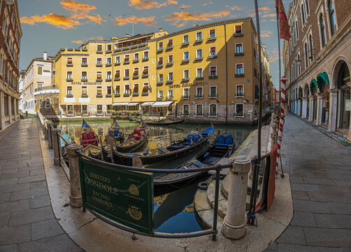 Gondola station (servizio gondole) at the Bacino Orseolo Gondola, in the small Rio Orseolo o del Coval bay, in front of the old Cavalletto and Doge Orseolo hotels, Venice, Italy