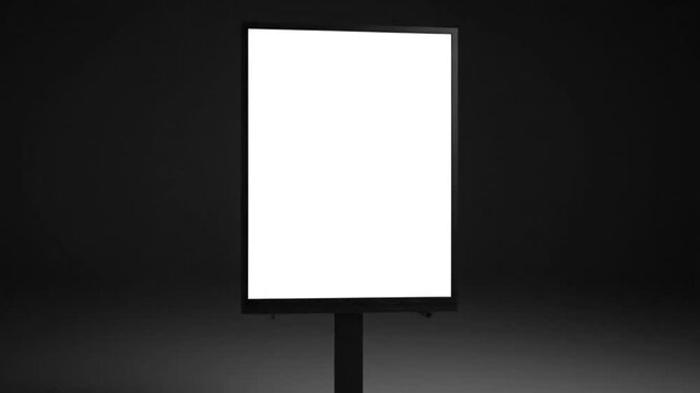 Glowing vertical blank billboard on pole against dark background