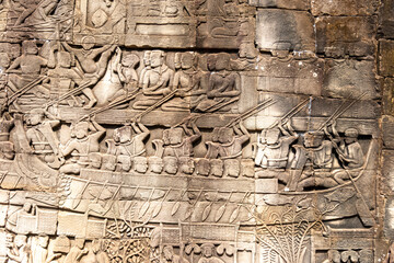 Angkor Thom, Siem Reap, Cambodia.  Detailed carvings of the Khmer army on the East gallery in the temple