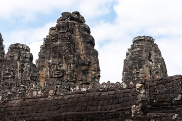 Angkor Thom, Siem Reap, Cambodia.  The Bayon temple, a major attraction - detail of faces on the towers