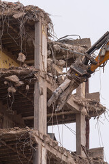 Demolition of a building using hydraulic shears