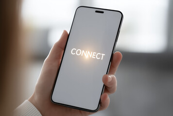 a hand holding smartphone with "connect" text displayed on the screen