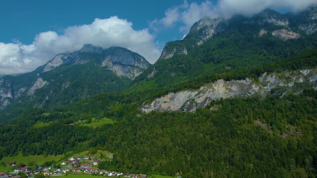 Aerial panoramic view around the old town city of Flums  in Canton Sankt Gallen in Switzerland on a sunny spring day.