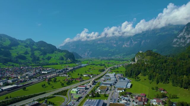 Aerial panoramic view around the old town city of Flums  in Canton Sankt Gallen in Switzerland on a sunny spring day.