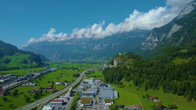 Aerial panoramic view around the old town city of Flums  in Canton Sankt Gallen in Switzerland on a sunny spring day.