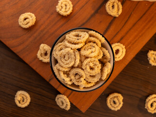 Fototapeta premium Murukku a south Indian snack on lifestyle setup.