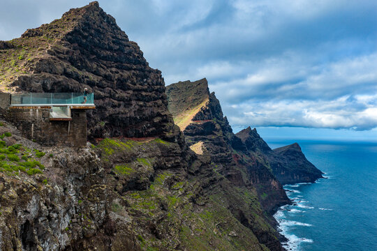 Dramatic aerial view of the Dragon Tail cliffs and Mirador del Balcon on the rugged west coast of Gran Canaria