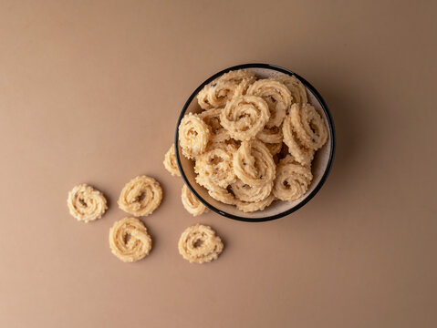 Murukku a south Indian snack on beige background.
