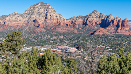 A panoramic view of Sedona, Arizona in a valley beneath red rock formations