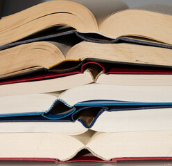 old books are laying on a table