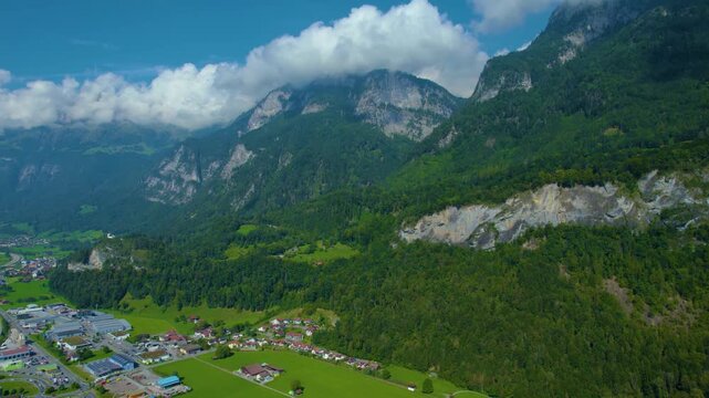 Aerial panoramic view around the old town city of Flums  in Canton Sankt Gallen in Switzerland on a sunny spring day.