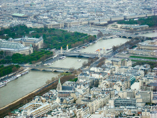 Fototapeta premium Aerial View of Seine River and Parisian Landscape with Bridges and Green Parks, Paris