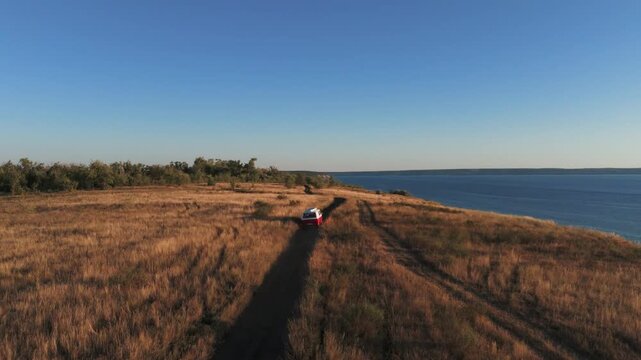 Camper van driving on a coastal road trip