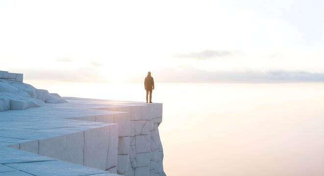 Person standing on cliff edge observing horizon daybreak sky scene