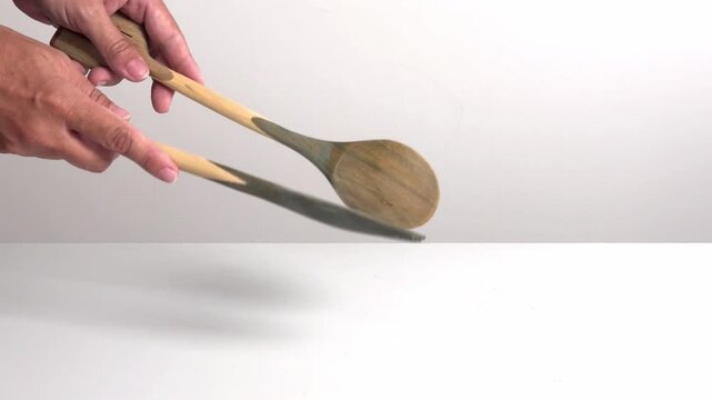 Video with real sound effect of Wooden spoons clacking together.