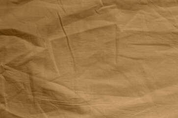 Brown crumpled fabric. Background texture.