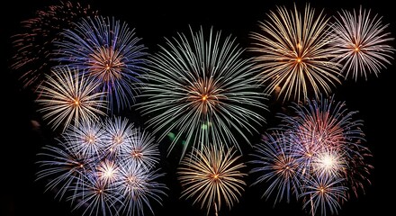 Fototapeta premium Vibrant fireworks exploding in the night sky with colorful bursts of light
