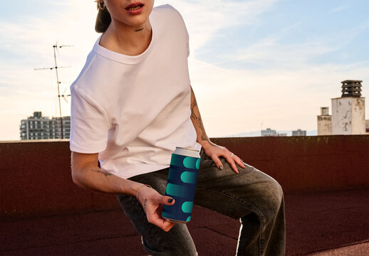 Real photo of woman Holding Can on Rooftop at Sunset ready for mockup
