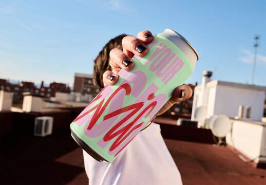 Real photo of womanHolding a Blank Can on a Rooftop ready for mockup