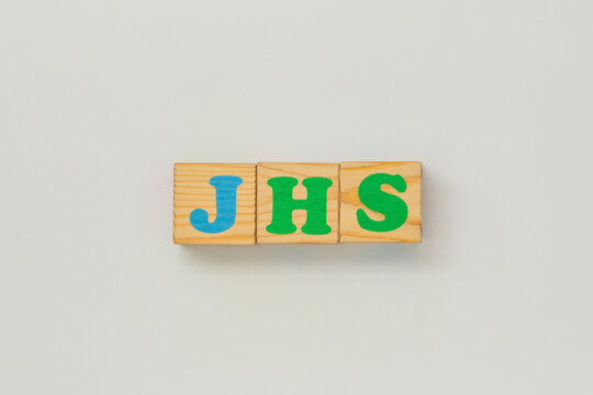 JHS abbreviation assembled from wooden blocks
