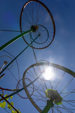 Bicycle rims in a blue sky
