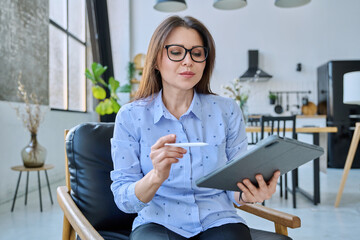 Webcam view woman entrepreneur, teacher working online remotely in home office