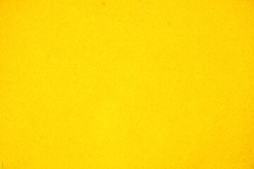 Obraz premium Soft bright yellow felt fabric texture for social media post and banner wallpaper backdrop isolated on horizontal ratio background.