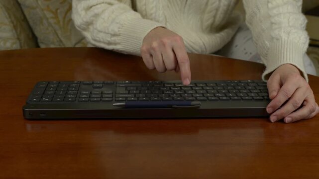 Typing with one finger on a membrane keyboard with sound