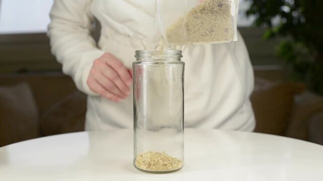 Pouring Rice Into Glass Jar For Kitchen Storage with Sound