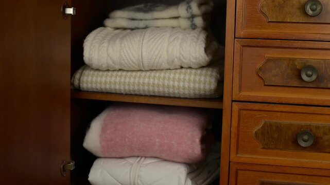 Opening and closing door of a wooden cabinet with a sound of magnetic click of a cabinet door catch and creaking hinges, and the deep, solid wood-on-wood thud upon closing with sound