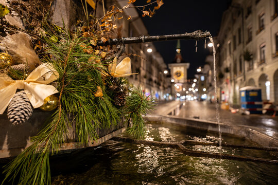 Bern, Switzerland - November 19, 2024: The historic streets of Bern's old town illuminated in the evening in the winter months and during the Christmas season.