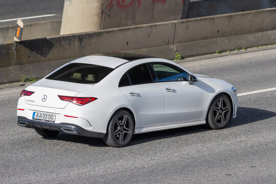 White mercedes benz cla 200d driving on highway