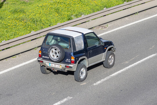 Suzuki vitara suv driving on rural road