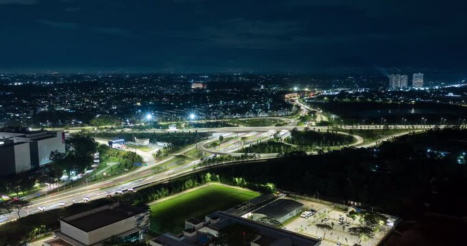 Timelapse of a busy highway intersection in Jakarta satellite city (BSD) at night