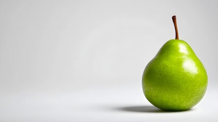 A Single Ripe Green Pear on a Clean White Background.