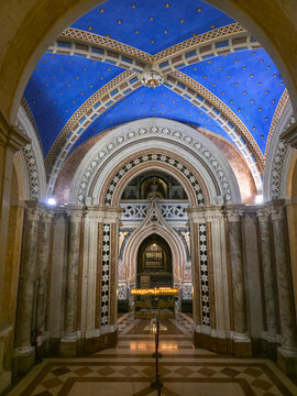 Neo-Gothic crypt of the Basilica of Santa Chiara in Assisi, featuring a starry blue vault and the saint's tomb, built between 1850 and 1872 to house her rediscovered remains