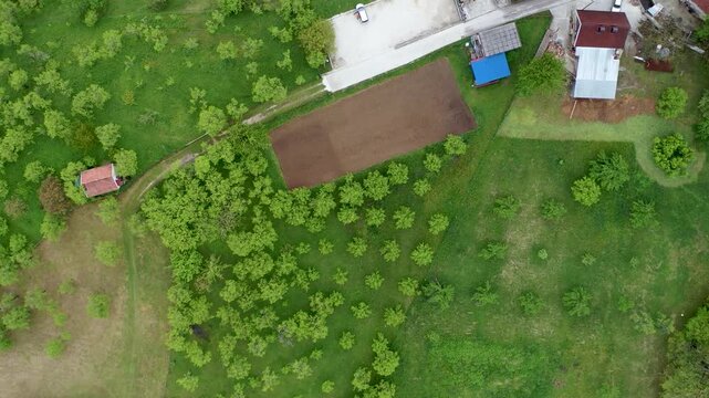 Top down drone shot of green field