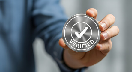 Man holding verified badge with checkmark in modern office setting  