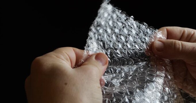 Popping blisters on the packaging film with your fingers