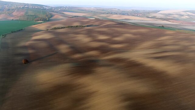 Aerial shadows across farmland