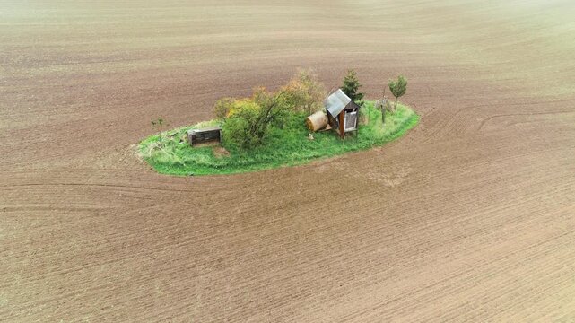 Aerial farmstead in open field