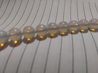 Opal beads in the paper