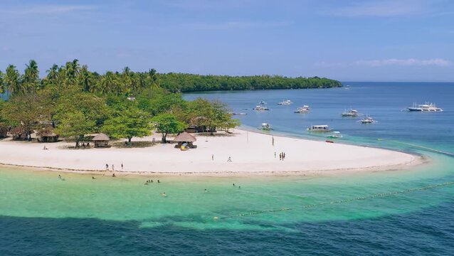 Drone view of quiet tropical beach and lagoon near a small island