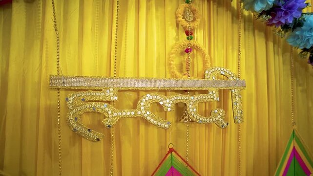 Yellow Haldi Ceremony Stage Decoration with Flowers and Traditional Design