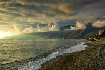Sunny evening with overcast low clouds after rain at a seaside resort