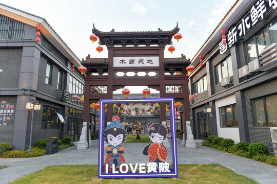 Cartoon Characters Display at Traditional Chinese Pagoda Street Entrance